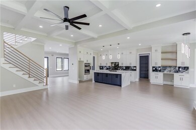 Unfurnished living room with stairs, beamed ceiling, recessed lighting, light wood-type flooring, and ornamental molding