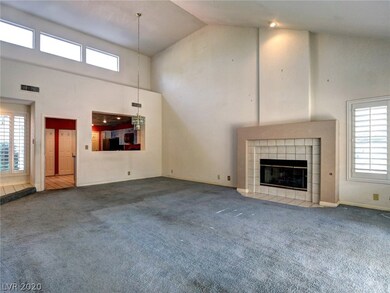 Living room with dining area and fireplace