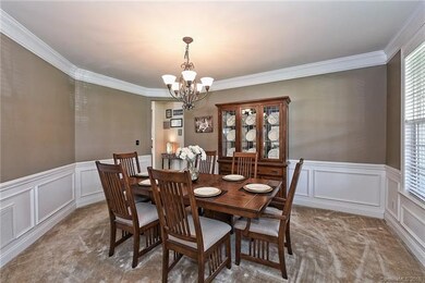 Dining Room with Crown Moulding & Wainscoting
