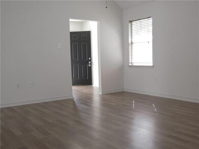 View of living room (15.5 x 16) with vaulted ceili