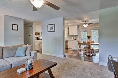 Open concept floorplan. Family room open to dining room and kitchen.