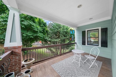 Wooden terrace featuring a porch