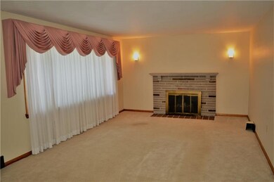 Living Room With Large Window and Fireplace, Looki
