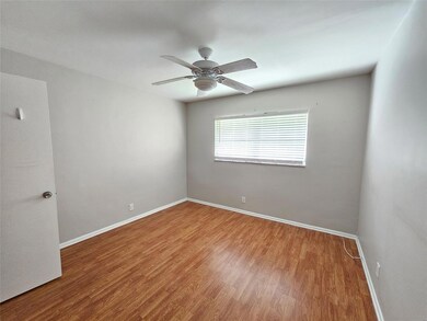 Great size bedroom with wood like flooring