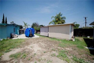Sheds on side of front house.