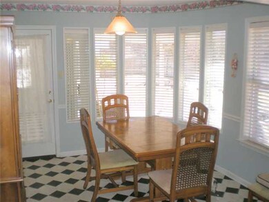 Eat-in kitchen surrounded by plantation shutters