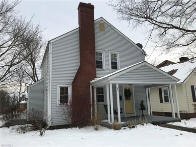 Brick chimney and bold yellow doors add a bit of c