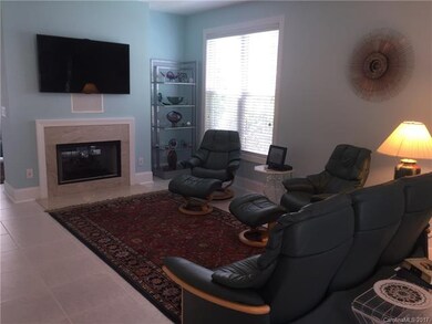 Two-way fireplace and lots of light in this end-un