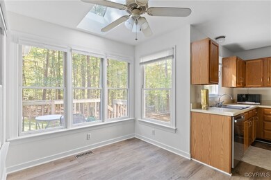Kitchen featuring lvp, sink, plenty of natural lig