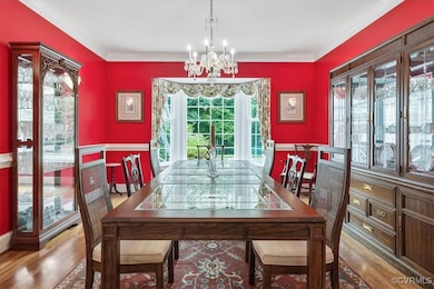 Dining space featuring a chandelier, wood finished