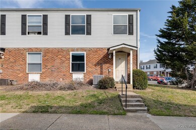 View of front of property with a front lawn, cooli