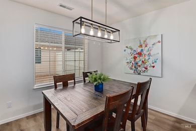 Dining room featuring wood finished floors and baseboards