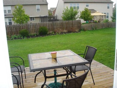 Exterior Back. VIEW OF THE DECK AND BACKYARD FROM THE BREAKFAST ROOM.