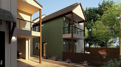 View of side of home with a balcony and a shingle