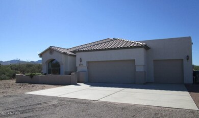 Front   3 car Garage and Courtyard