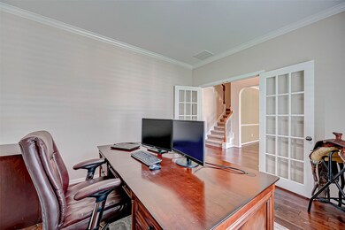 Beautiful French doors and crown molding.
