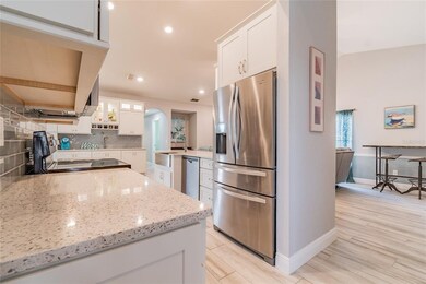 Updated kitchen with quartz counters, farmhouse si