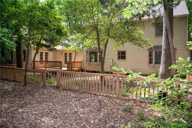 Rear view of property with a deck