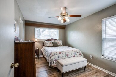 Primary Bedroom has a recently updated large picture window (Renewal by Anderson) over the bed, a 2nd window, LVP flooring, ceiling fan, recent paint, & private door to the full bath.
