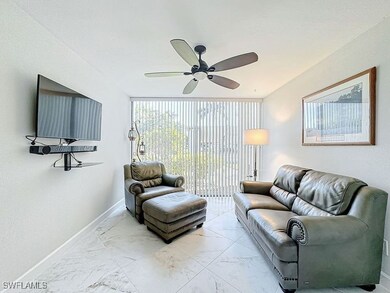 Living room featuring ceiling fan