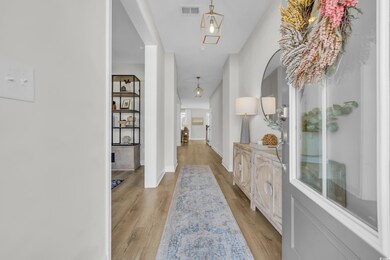 Hall featuring light hardwood / wood-style floors