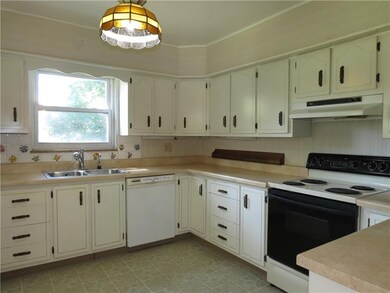 Plenty of cabinet space in this cheery kitchen!