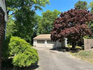 672 sf detached garage has 3 overhead doors w/ aut