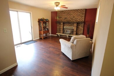 Enjoy the fireplace in this room with sliding glas