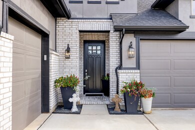 Abundant parking with three garage bays and an extra wide driveway leading you right up to this striking front door!