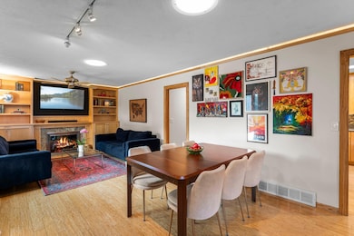 The dining area flows seamlessly into the spacious living room.
