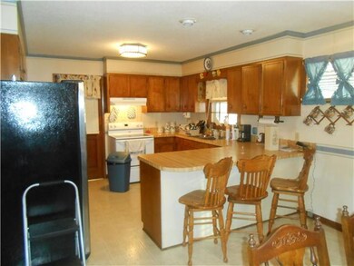 Open kitchen with bar seating.