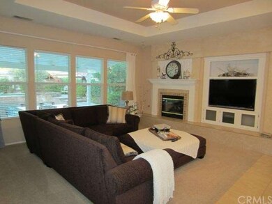 Family Room with Fireplace with Travertine Face, B
