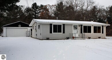 The garage is constructed of concrete block and pr