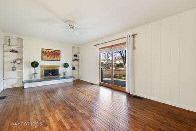Gas-log fireplace and sliding glass door to patio