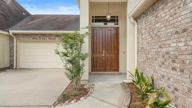 Front porch with tall wooden doors.