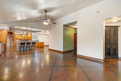 Living room opens up to the kitchen and dining are