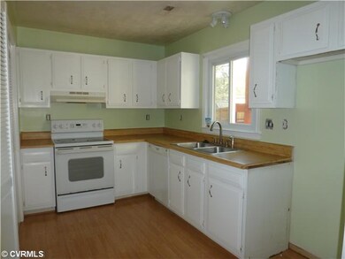 Kitchen - Smooth Top Range, Dishwasher, & Pantry. 