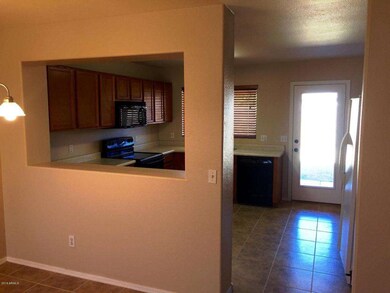 View into Kitchen w/Pass Through Window