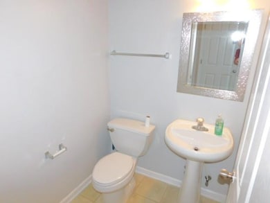 Bathroom featuring toilet and tile patterned floors