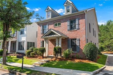 View of front of home featuring brick siding and a front yard