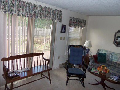 LIVING ROOM WITH SLIDER TO DECK AND...