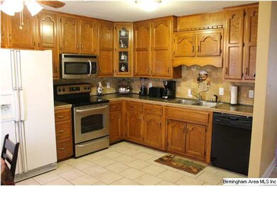 Kitchen has Beautiful Wooden Cabinets and Granite 