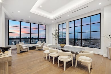 The light-filled gathering room has a definite “wow” factor with its breathtaking views. Here modern design meets understated luxury.