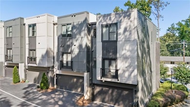 End unit with attached 2 car garage and Juliette balcony. Front of home has Rooftop balcony looking over the tree lined street.