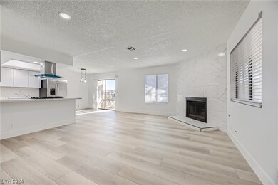 Living Room.  Fireplace with gas stub, recessed li