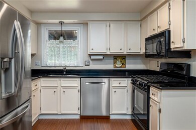 Lots of character in this black and white kitchen.