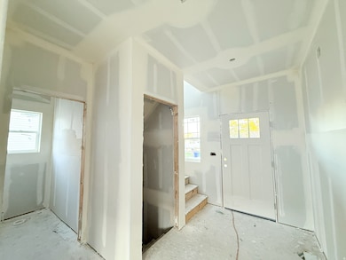 Foyer entrance featuring stairway