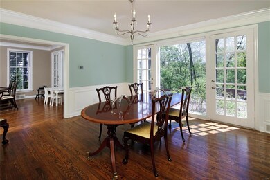 The lovely dining room has two doors to the patio 