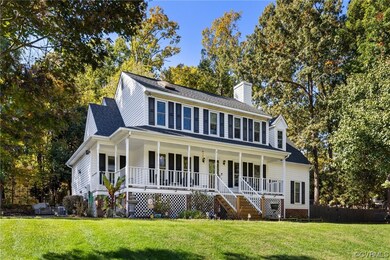 View of front of home featuring a front yard and c