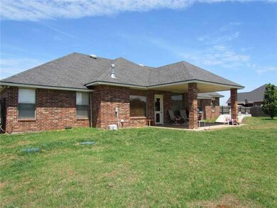 Exterior Back. large covered patio approximately 1
